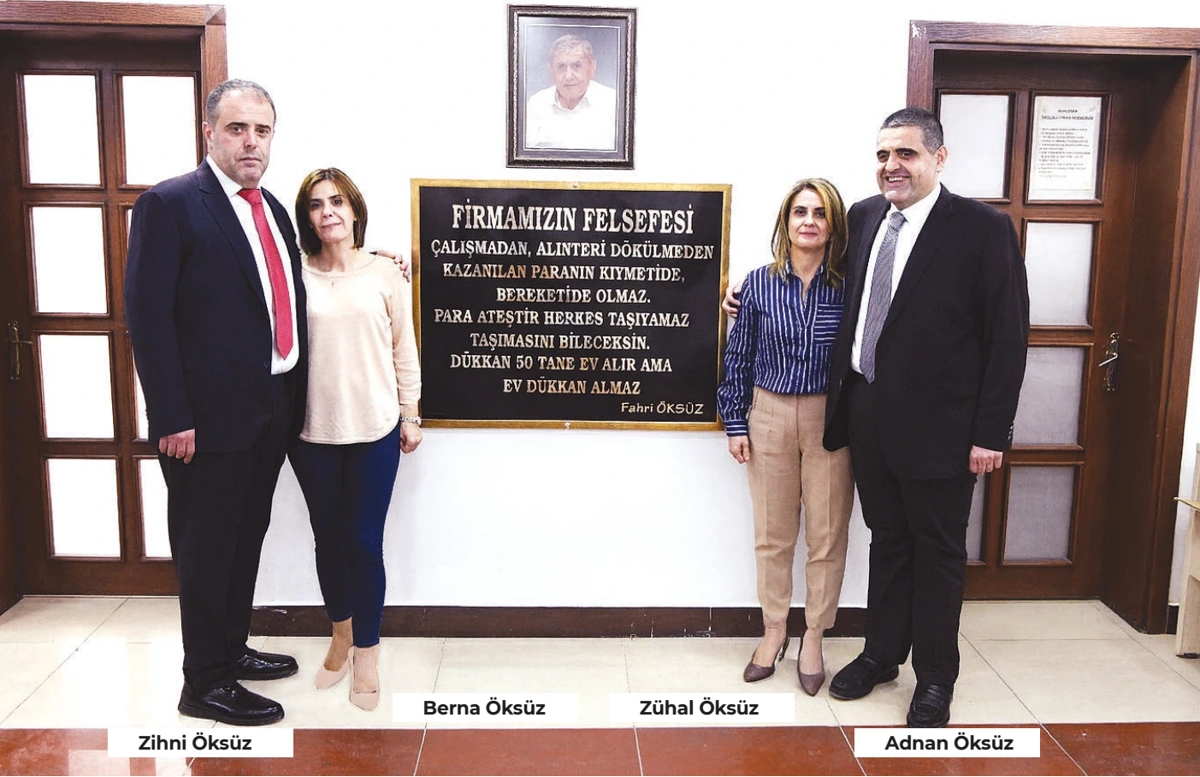 Öksüzler ailesi, Fahri Öksüz’ün firma felsefesinin yer aldığı pano önünde